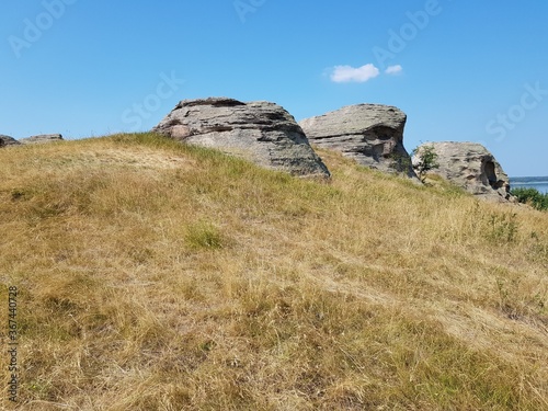 Stone granite rock in the steppe