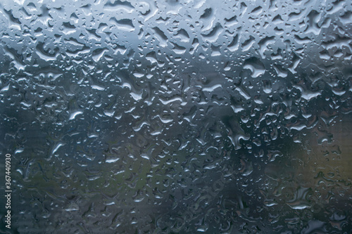 Summer rain drops on glass.