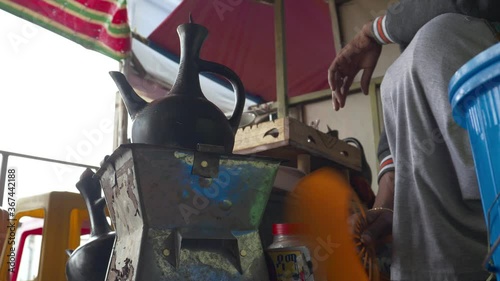 Coffee drink being prepared with traditional way, using coal and fire instead of high technology machines. photo