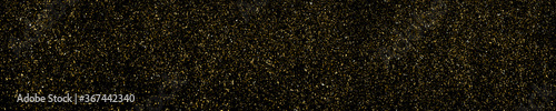 Gold glitter texture isolated on black. Amber particles color. Celebratory panoramic background. Golden explosion of confetti. Long horizontal banner. Vector illustration, EPS 10.