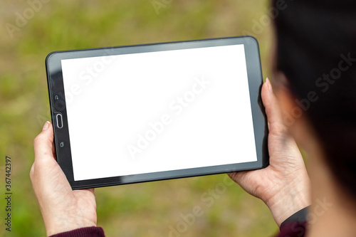 Hand with tablet lying on it, map-case close-up, white screen mockup, layout.