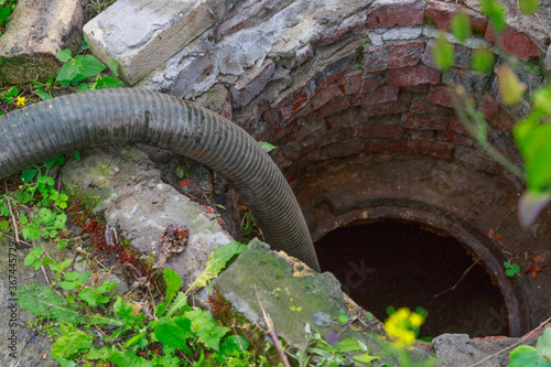 Pipe of a Sewage Pumping Machine. Providing Sewer Cleaning Service Outdoor
