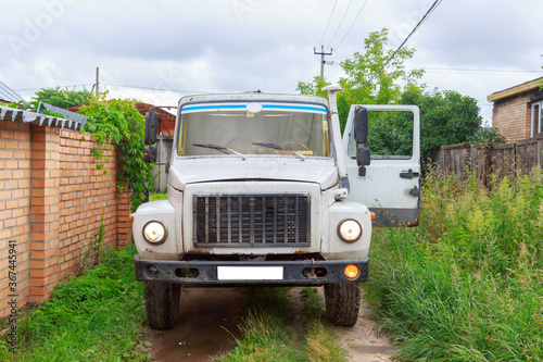 A Sewage truck working in village environment © галина шарапова