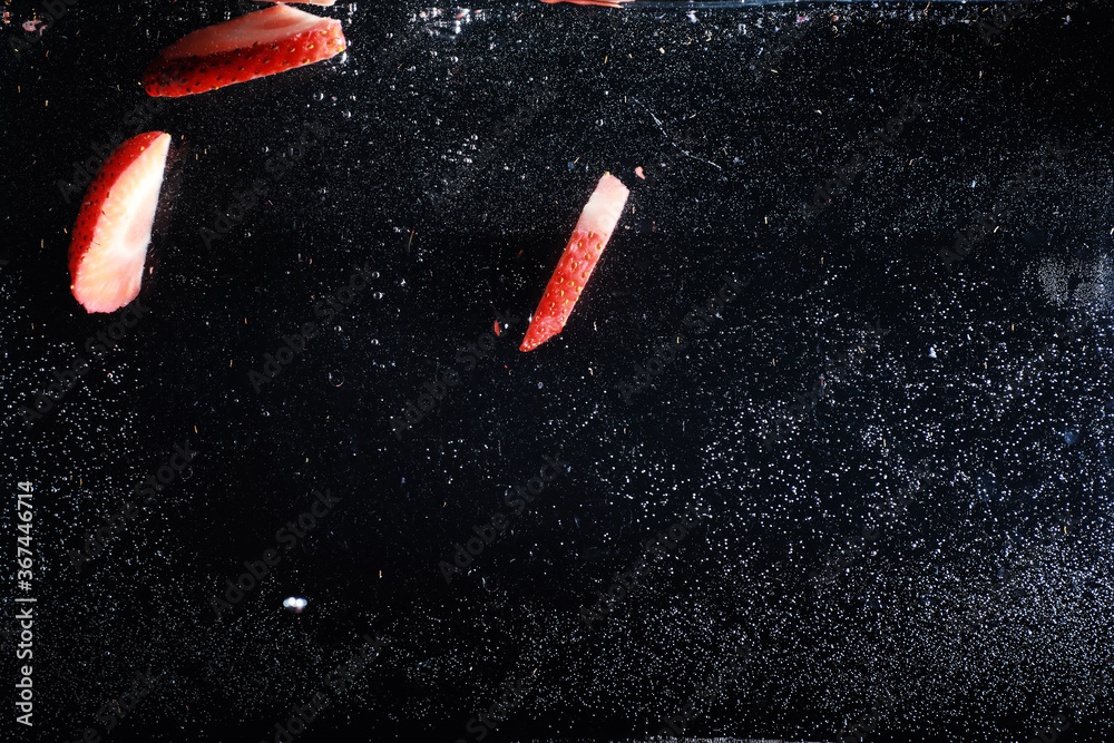 Water drops on ripe sweet strawberry. Fresh berry background with copy space for your text. Vegan food concept. Water drops on ripe sweet strawberry. Fresh berry background with copy space for your text. Vegan food concept.