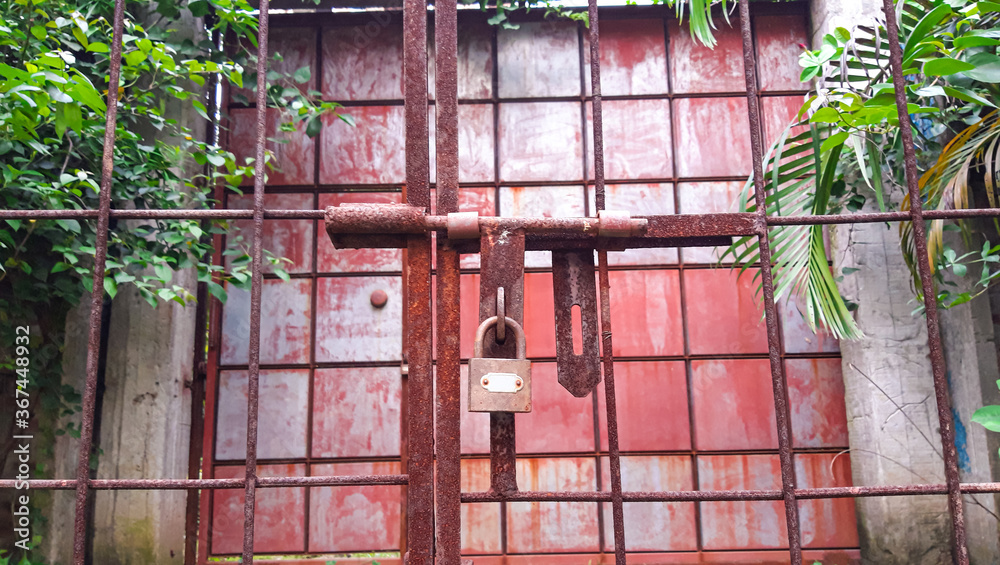 Closed Iron Gate with lock. Padlock on Iron Gate.	
