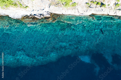 Aegean seashore and marble rocks in Aliki, Thassos island, Greece photo