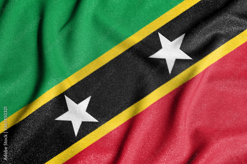 National flag of the St. Kitts and Nevis. The main symbol of an independent country. Flag of St. Kitts and Nevis. An attribute of the large size of a democratic state.