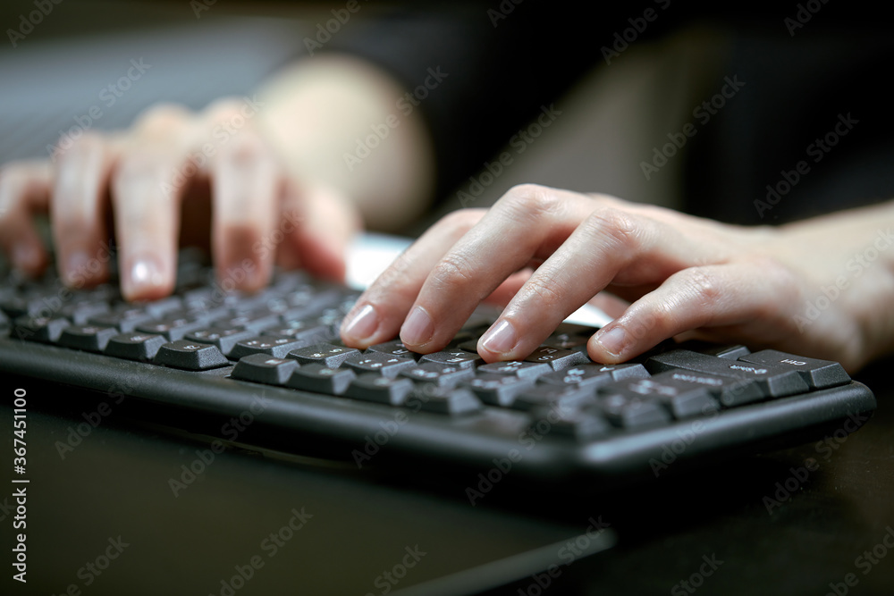 Female hands or woman office worker typing on the keyboard Female hands or woman office worker typing on the keyboard