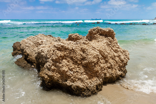 A beautiful large rock-rock on the Givat Olga beach in Hadera. Israel. photo