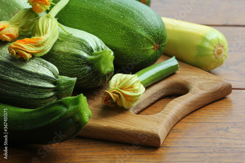 Fresh organic zucchini on the wooden table