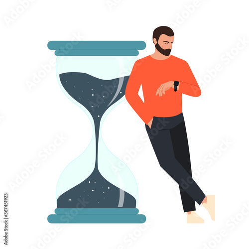 The man looks at his watch in anticipation.