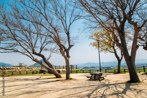 Picnic table with city view at Marugame castle park in Kagawa, Japan photo