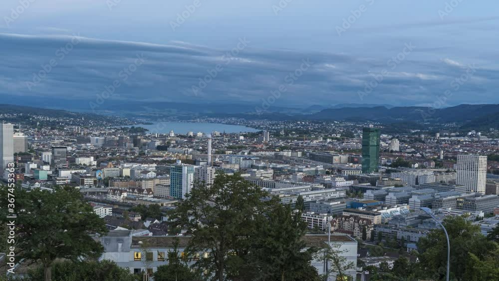 Zurich, Switzerland - July 26, 2020: Day to night transition - holy grail - time lapse of city of Zurich, a global center of banking and finance.
