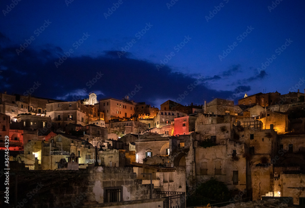 Night landscape of the Sassi of Matera a historic district iin the city of Matera well-known for their ancient cave dwellings. Basilicata. Italy