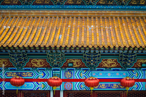 Detail of monastery roof and lanterns in Hong Kong