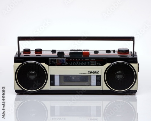 Vintage boom box on white background with reflection
