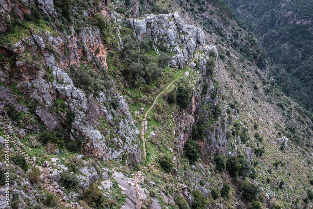 Narrow path among rocks in Kadisha Valley also spelled as Qadisha in Lebanon Narrow path among rocks in Kadisha Valley also spelled as Qadisha in Lebanon