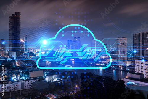 Information cloud hologram, aerial panoramic cityscape of Bangkok at night. The concept of secure storing digital data in Asia. Multi exposure.