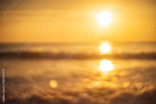 Tropical beach with smooth wave and sunset sky abstract background.