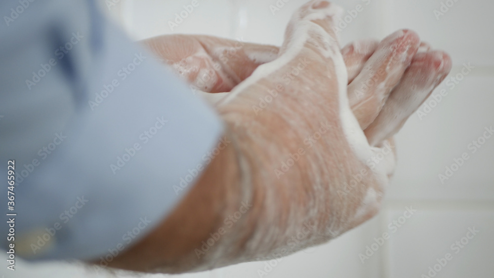 Person Washing His Hands with Soap and Water, Cleans and Disinfect Against Viruses and Diseases Person Washing His Hands with Soap and Water, Cleans and Disinfect Against Viruses and Diseases