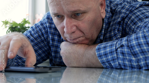 Sad Person Isolated in Quarantine Looking Bored and Disappointed to a Cell Phone