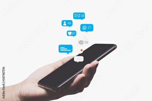 Person hand using a smartphone with social media marketing concept.