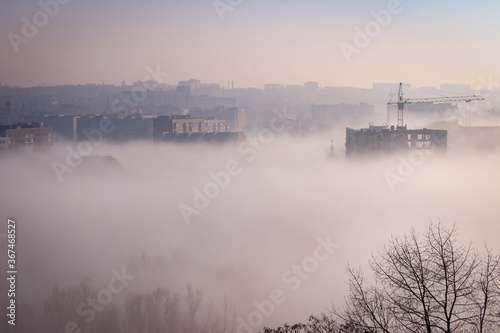 Fototapeta Naklejka Na Ścianę i Meble -  Aerials View To City In The Strong Morning Fog