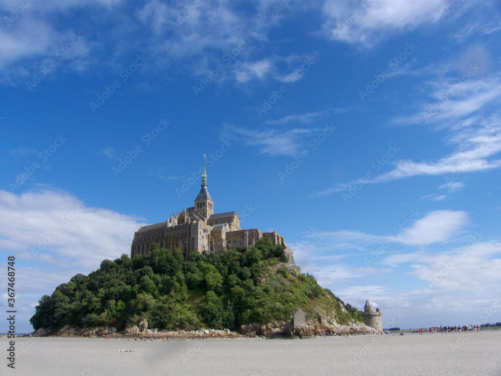 Mont Saint-Michel, France, it's an island in Normandy with a sanctuary in the middle built in honor of Saint-Michel
