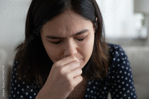 Close up of unhappy young Vietnamese woman cry suffer from mental psychological problems at home, upset millennial Asian girl feel lonely distressed, mourn or yearn, struggle with miscarriage problem
