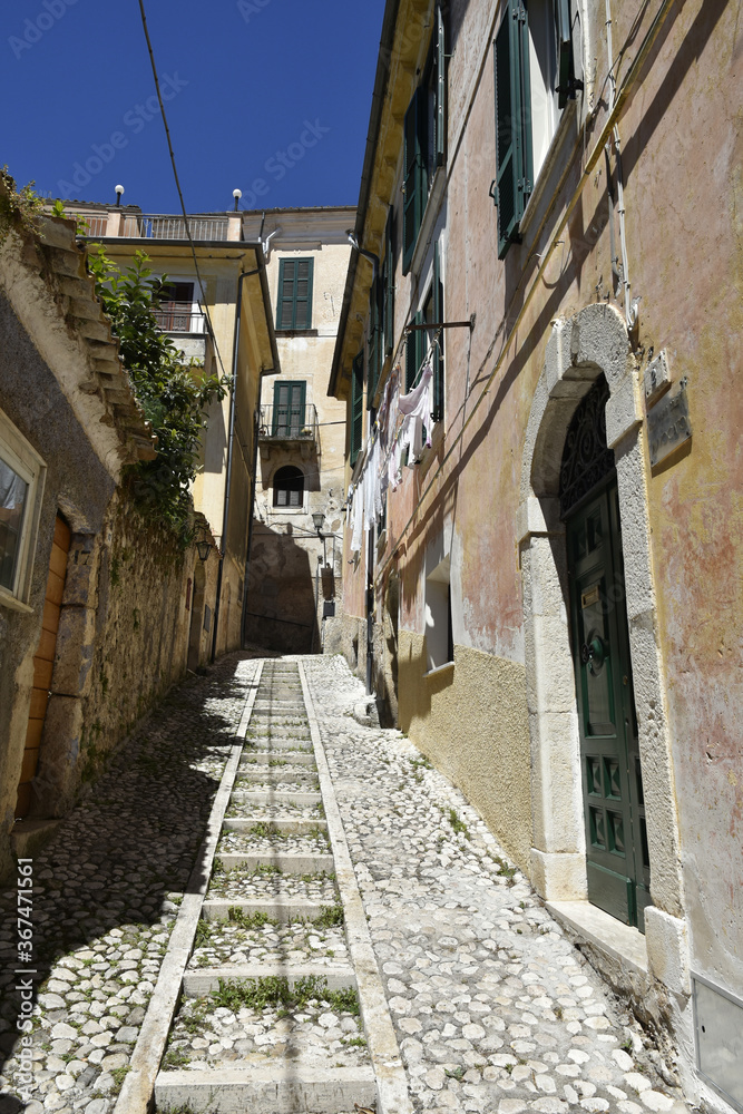 Fototapeta premium A narrow street in the old buildings of San Donato Val di Comino, a medieval village in the Lazio region.