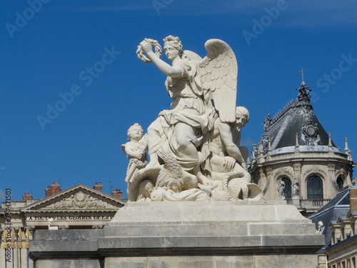 Versailles, France, the palace of Versailles with a beautiful garden in front of facade with a lot of fountains and statues