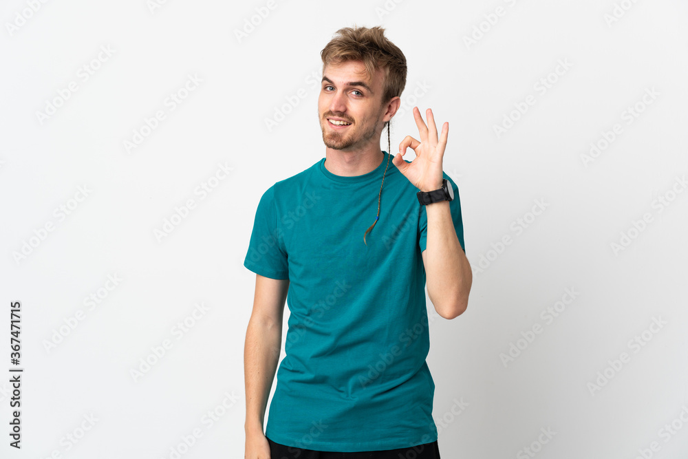 Young handsome man isolated on white background showing ok sign with fingers Young handsome man isolated on white background showing ok sign with fingers