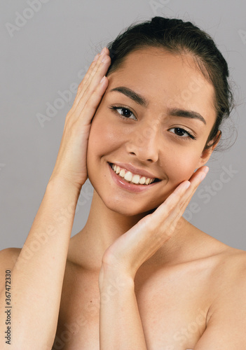 Woman beauty hands face smile skin care