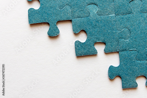 Puzzle. Many puzzle pieces on white background. The concept of collective thinking.
