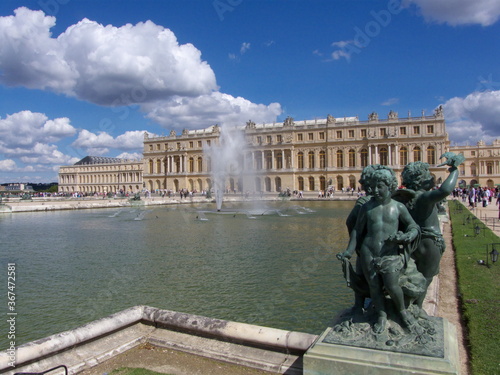 Versailles, France, the palace of Versailles with a beautiful garden in front of facade with a lot of fountains and statues