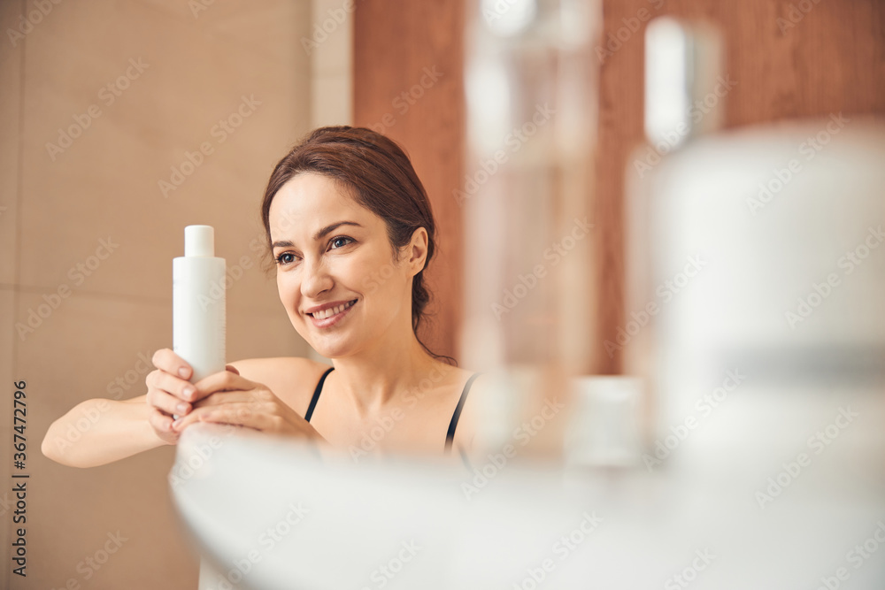 Lovely contented woman enjoying a hydrotherapy procedure Lovely contented woman enjoying a hydrotherapy procedure