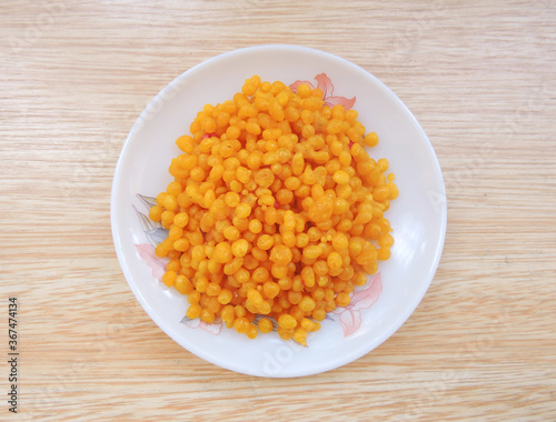 An Indian dessert made from sweetened, fried chickpea flour called Boondi in local language in India. Boondi is considered an important recipe in Hindu culture as it is distruted during festivals. 