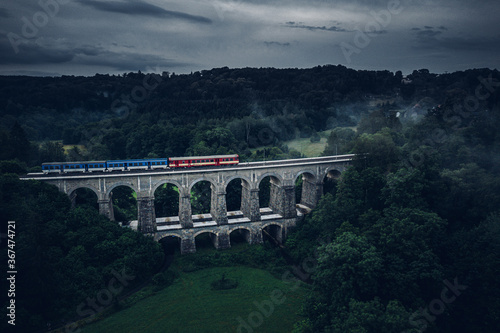 Sychrov stone railway viaduct was built in 1857-1859, construction was carried out by brothers Klein and V. Lanna. In the upper part there are 8 arches with a span of 9.5 meters. photo