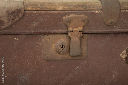 Old brown retro suitcase on a white background