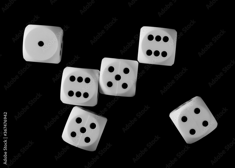 White gambling die, dice for tabletop games and poker isolated on black background, top view White gambling die, dice for tabletop games and poker isolated on black background, top view