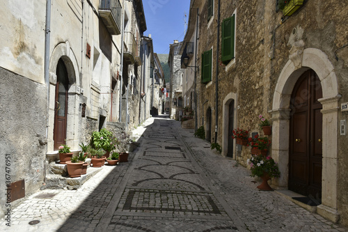 Fototapeta Naklejka Na Ścianę i Meble -  A narrow street in the old buildings of San Donato Val di Comino, a medieval village in the Lazio region.
