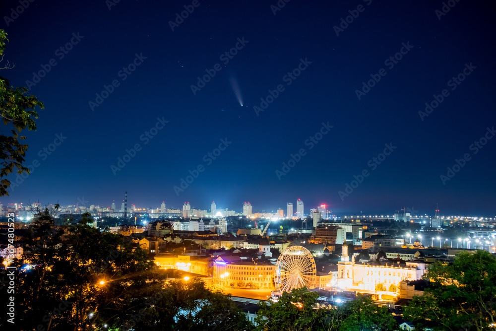 Comet C/2020 F3 (NEOWISE). Aerial view of night city. Kyiv, Ukraine.