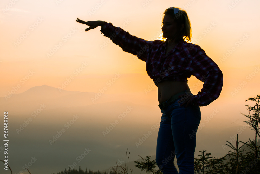 girl tourist high in the mountains