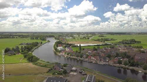 Nieuwekerk aan de Amstel, a place in Holland with a beautiful church at the river side photo