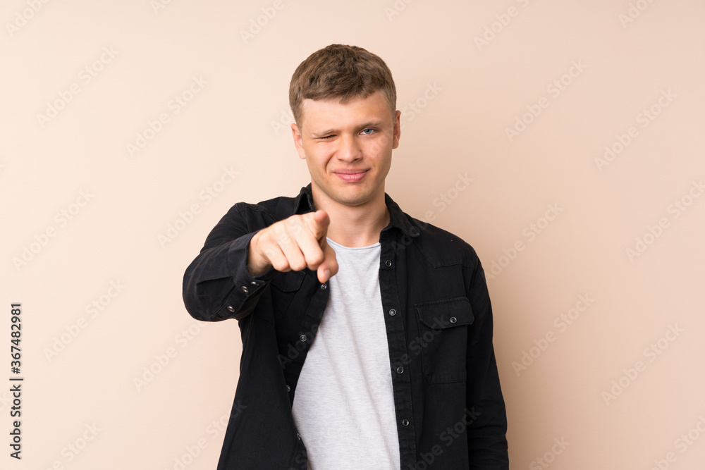 Young handsome man points finger at you Young handsome man points finger at you