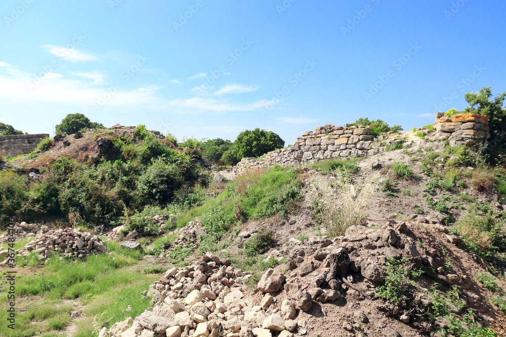Ruins of stone fortress wall in ancient Troy city, Turkey