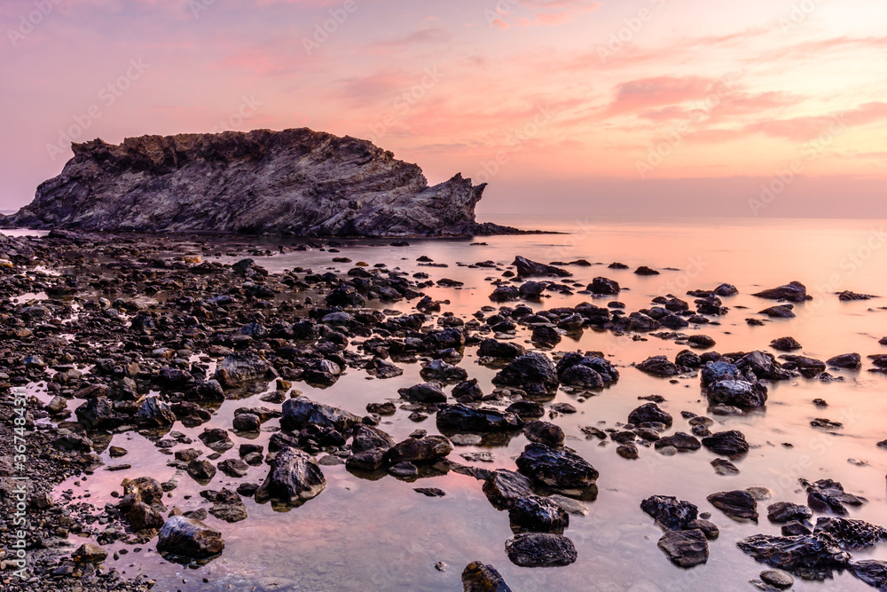 Obraz premium Beautiful dawn at the coastline of Mediterranean Sea (Beach of Carbasso, Catalonia, Spain), Costa Brava.
