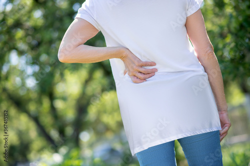 Woman feeling a pain in her lower back