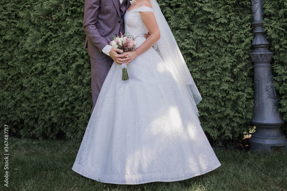 bride and groom in the park together at wedding