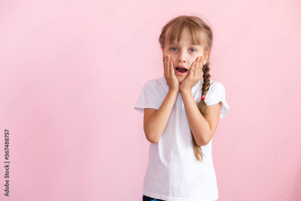 Cute Little Girl Covering Her Mouth Showing Intense Expression of Fear and Terror, Isolated Cute Little Girl Covering Her Mouth Showing Intense Expression of Fear and Terror, Isolated